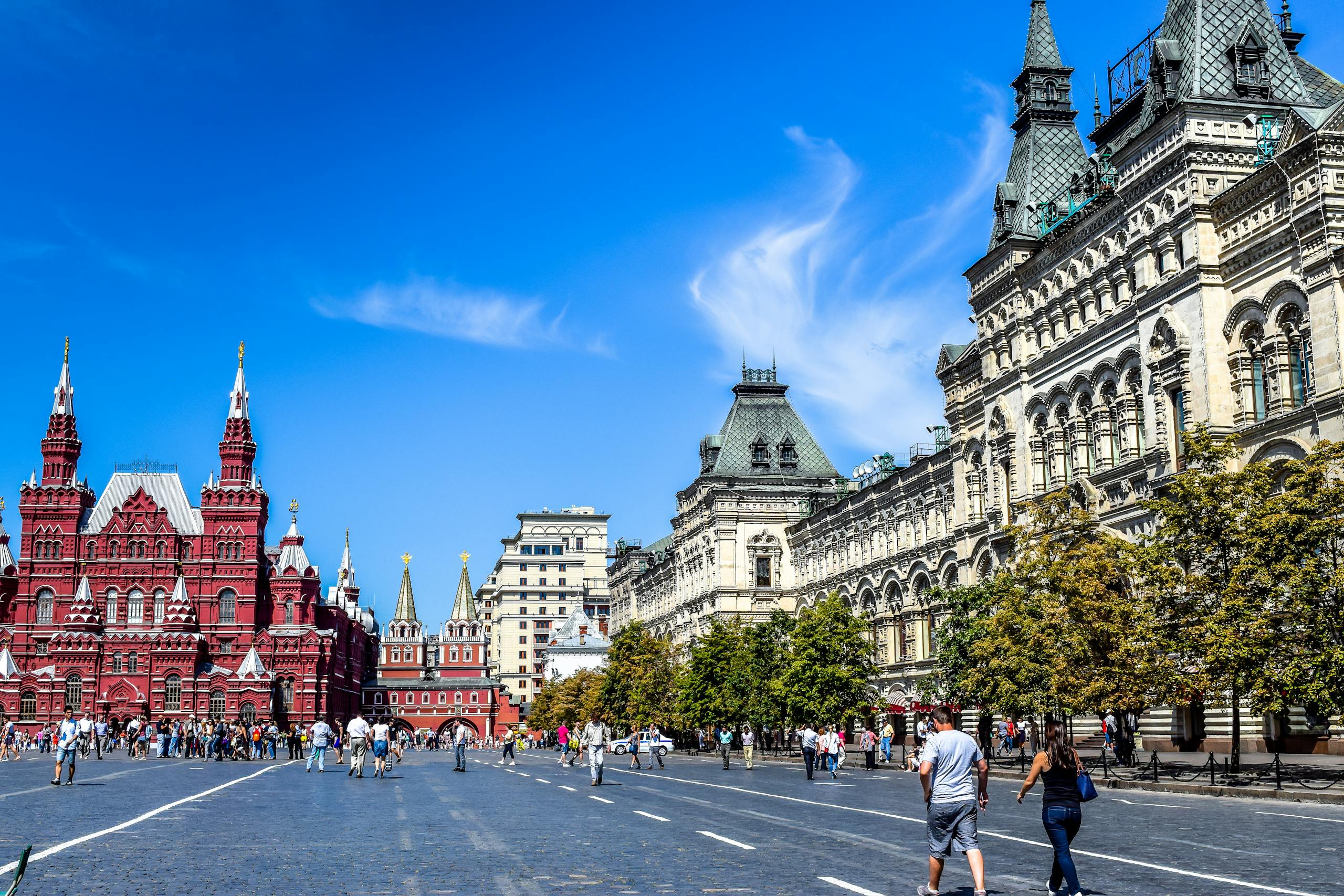 Red Square, Moscow captured on a bright day with tourists, historic architecture, and clear skies.
